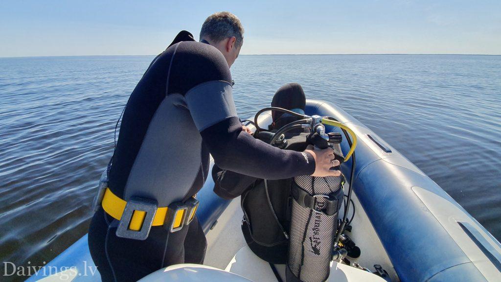 Divers from the RIB Motorboat Diving Club Daivings survey the wreckage