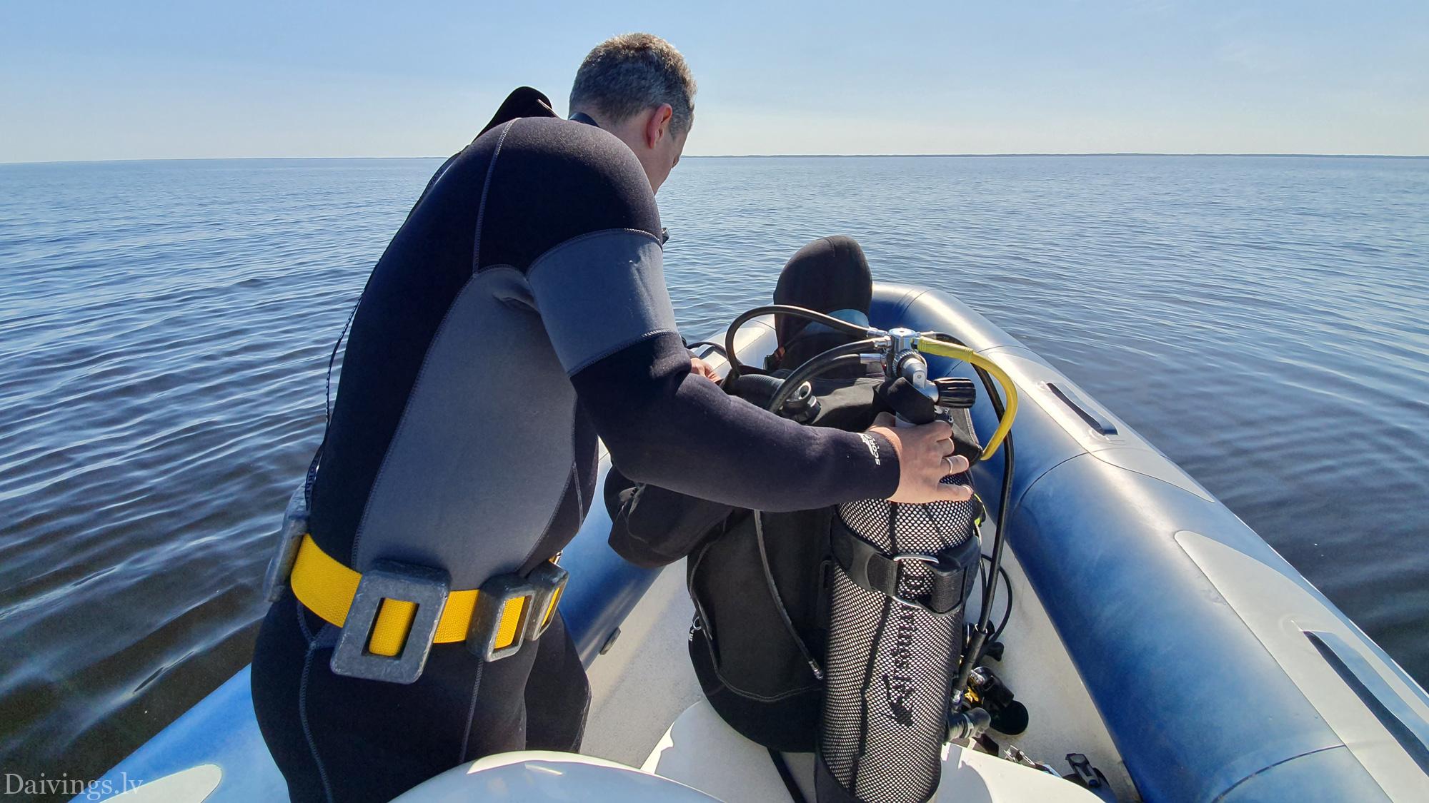 Divers from the RIB Motorboat Diving Club Daivings survey the wreckage